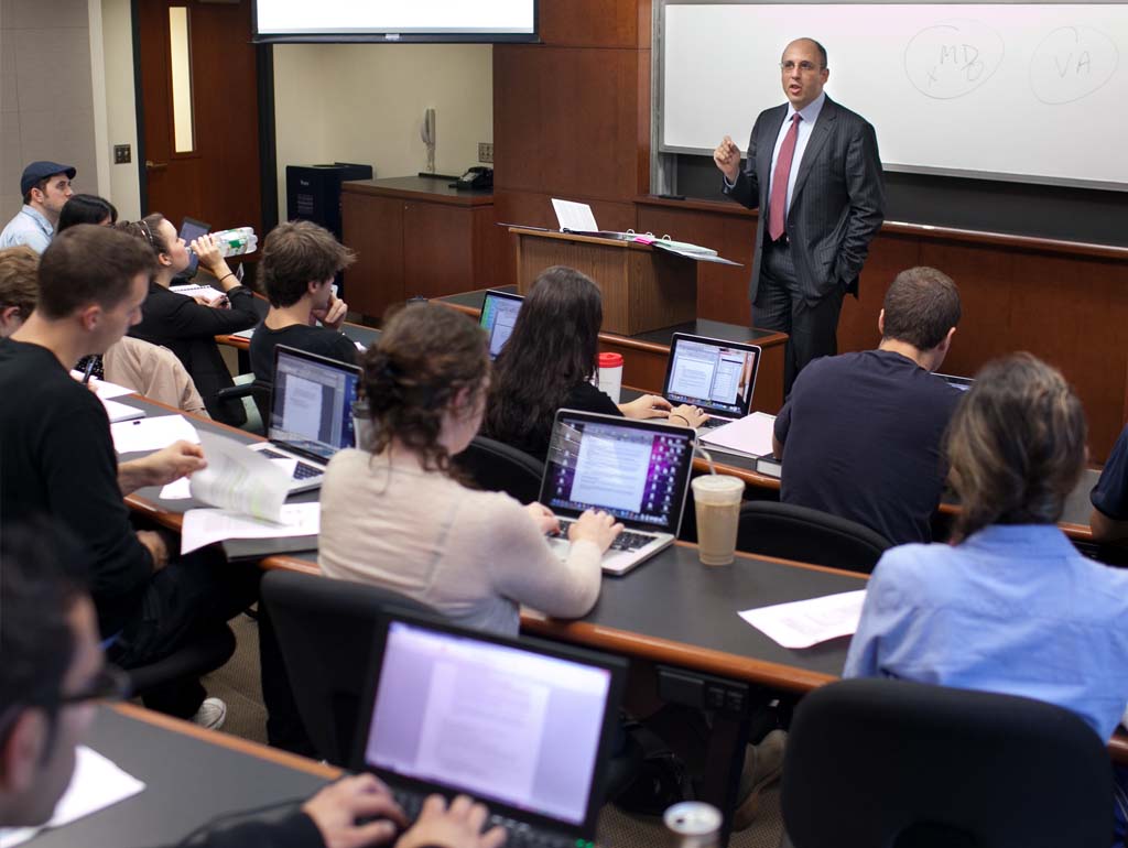 Students listening to a professor's lecture